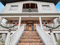 Brick Faced Stairway to Huge Covered Porch and Entry