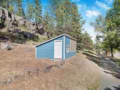 Outbuilding has been used as a greenhouse or a chicken coop